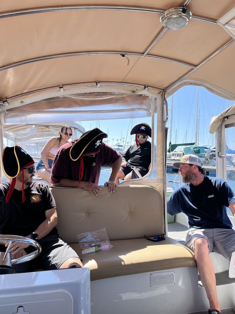 Group dressed as pirates on a Duffy boat
