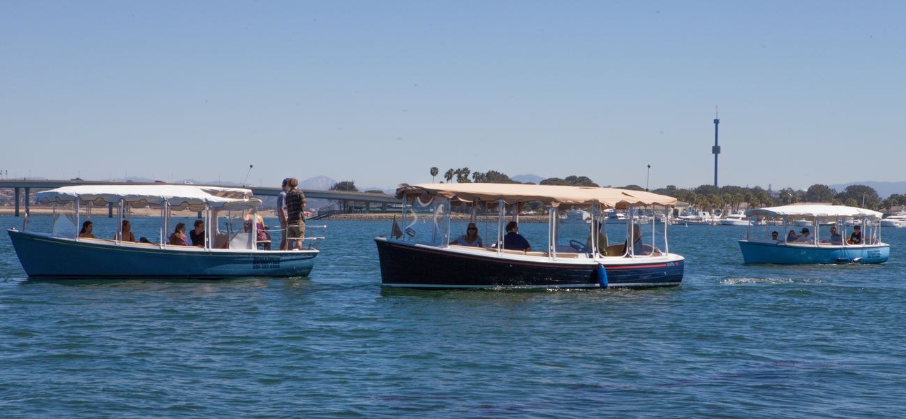 Tour boats anchored in coastal bay