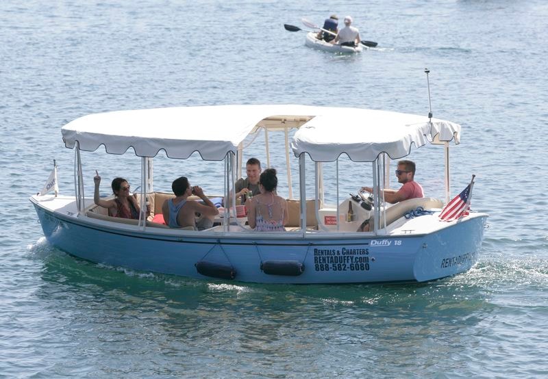 Guests enjoying a Duffy boat rental on Mission Bay